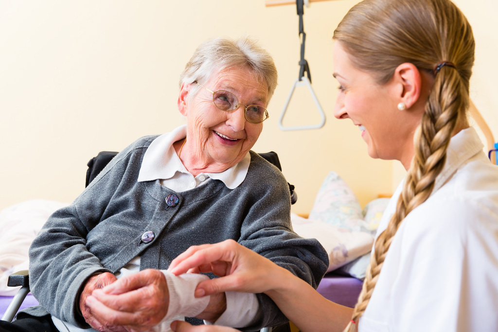 nurse-taking-care-of-senior-woman-in-retirement-home-picture-id498152916.jpeg